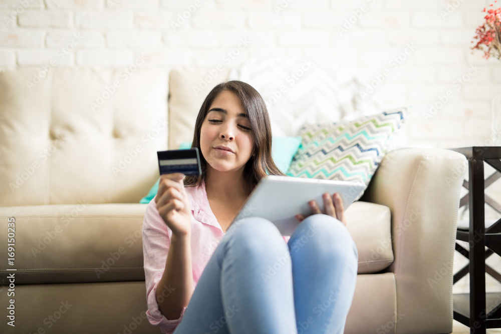 Woman paying online with credit card Woman paying online with credit card