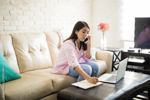 Free Download Young woman writing down a message - GFXLoad