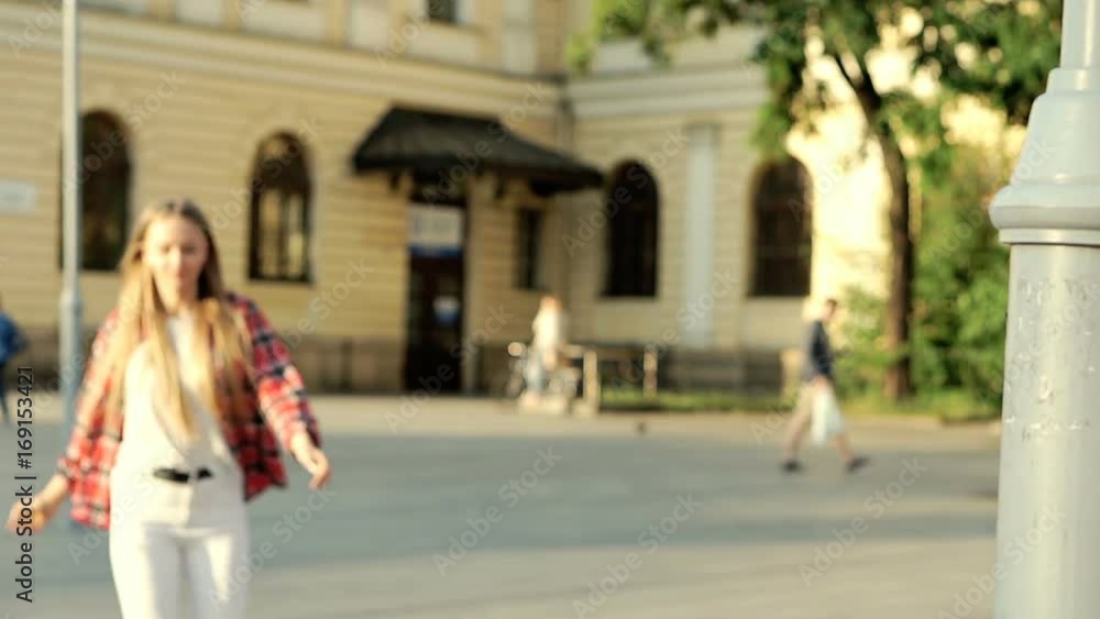 Pretty girl in checked shirt riding on rollerblades in the city, steadycam shot
Pretty girl in checked shirt riding on rollerblades in the city, steadycam shot