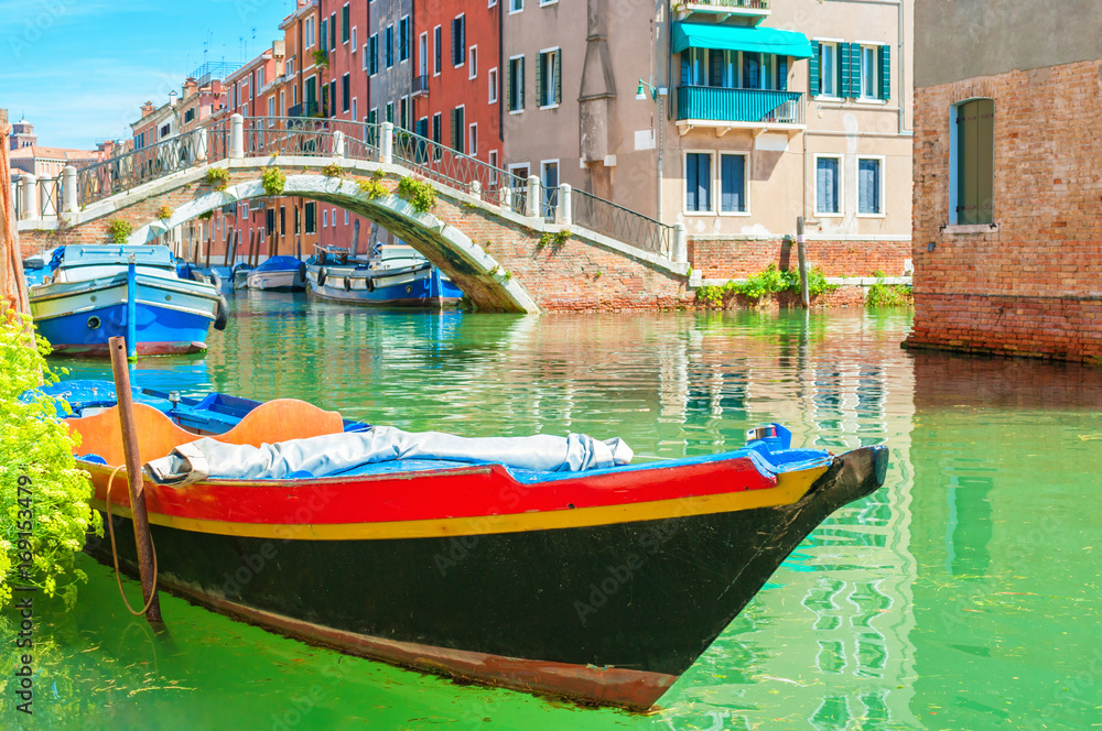 Boat floating on a canal, Venice Italy