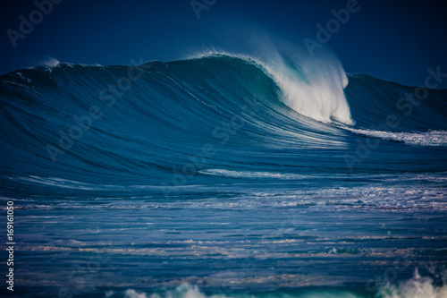 Big ocean wave on water surface of hawaiian aquatory photo