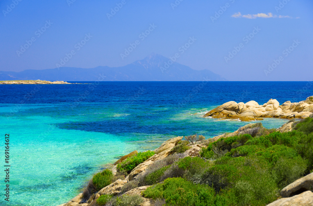 Sea coast under blue sky Sea coast under blue sky