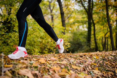 Woman jogger, focus on legs.