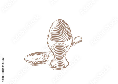 Egg in the stand for eggs and spoon