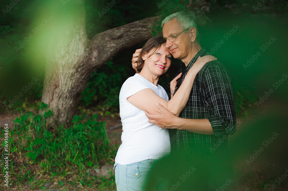 Senior couple strolling in the park Senior couple strolling in the park