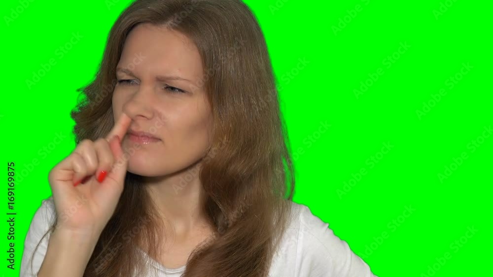 playful woman girl making facial expressions - picking nose with finger playful woman girl making facial expressions - picking nose with finger