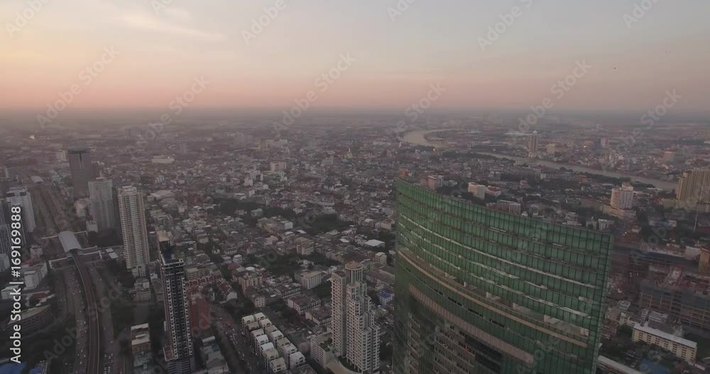 High Aerial Shot At Sunset Over Chao Phraya River And Thonburi District, Bangkok, Thailand
High Aerial Shot At Sunset Over Chao Phraya River And Thonburi District, Bangkok, Thailand