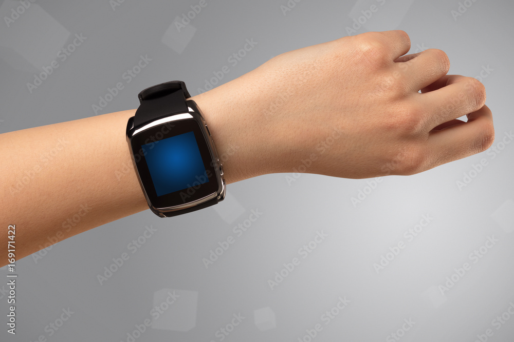 Female hand wearing smartwatch Female hand wearing smartwatch