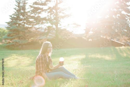 Wallpaper Mural Girl with a glass of juice on a green meadow Torontodigital.ca