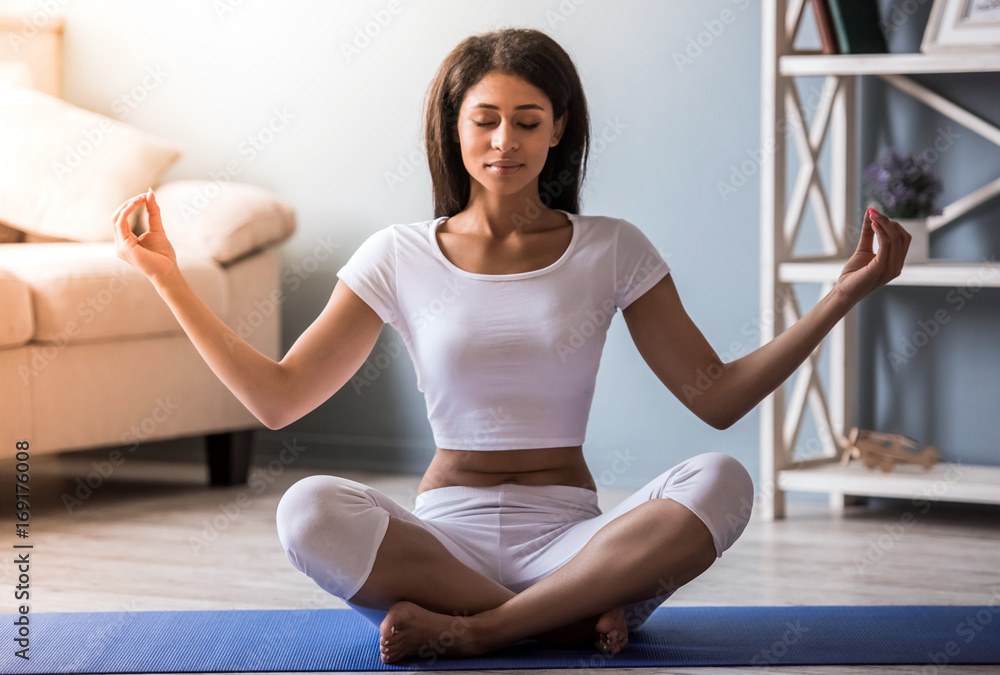 Afro American girl doing yoga