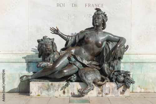 Lyon - Statue of Women with lion and part of the King Louis statue at the bellecour place