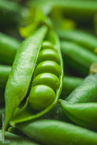 Fresh pea pods and peas closeup, macro