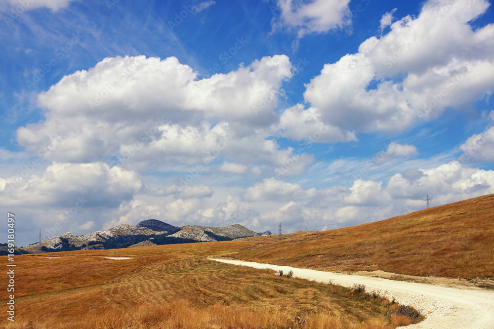 Landscape with a mountain country road. Balkans. Montenegro, Krnovo, near Niksic town