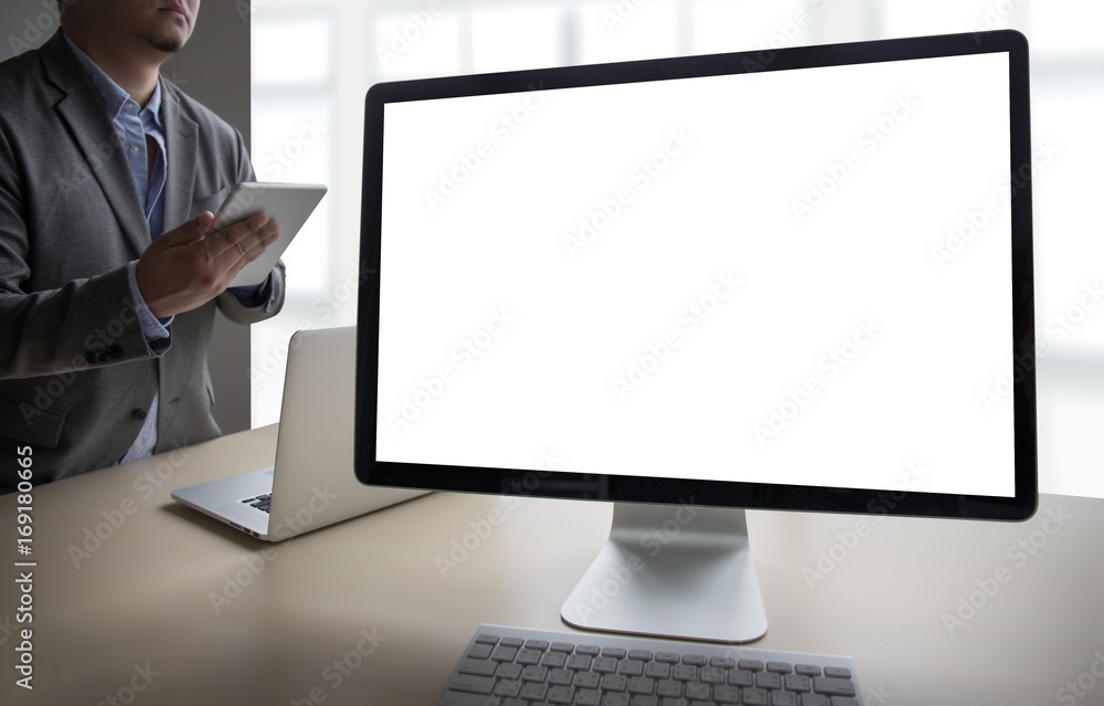 young man working Businessman using a desktop computer of the blank screen young man working Businessman using a desktop computer of the blank screen