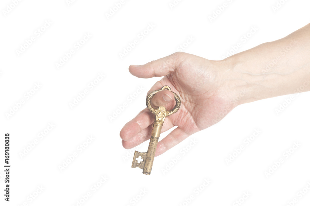 Man's hand with antique golden key