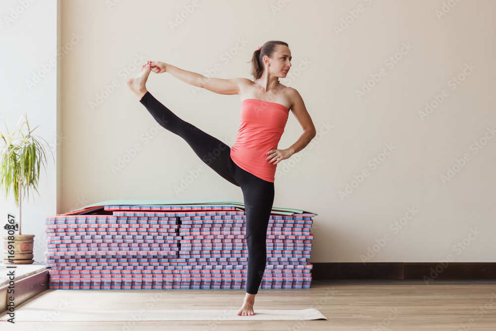 Woman makes yoga exercises Woman makes yoga exercises