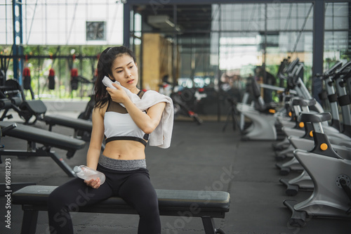 Portrait of pretty girl training on special sport equipment in gym