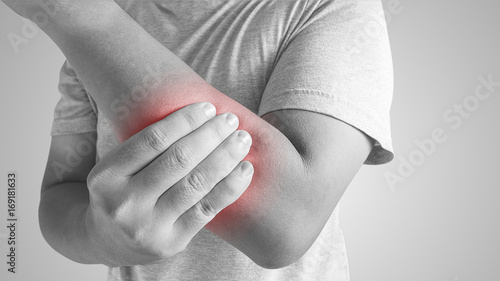 Arms Pain. man Suffering From Painful Feeling In Arm Muscles. health concept photo