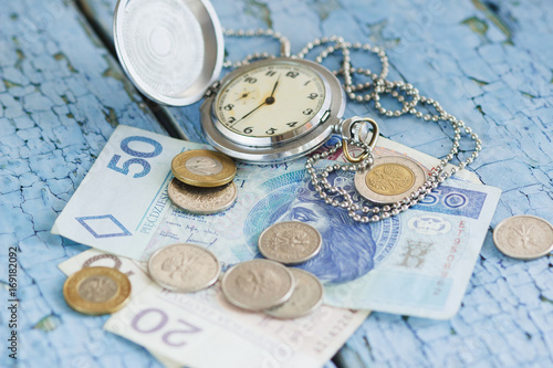 Polish zloty and a pocket clock