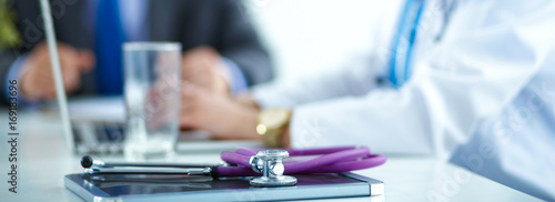 Wallpaper Mural Medical team sitting at the table in modern hospital Torontodigital.ca