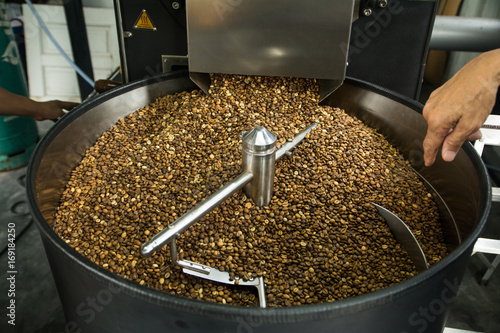 Freshly roasted coffee beans in professional roasting machine