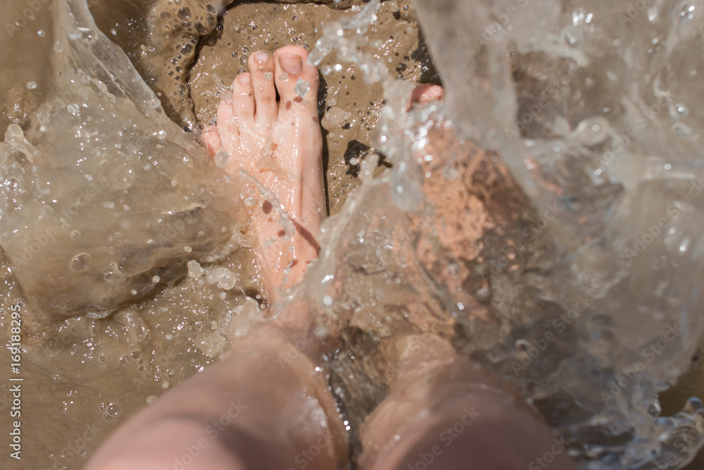 Fototapeta premium Feet in the water