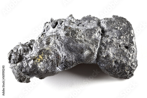 natural platinum nugget from Nischni-Tagil (Russia) isolated on white background photo