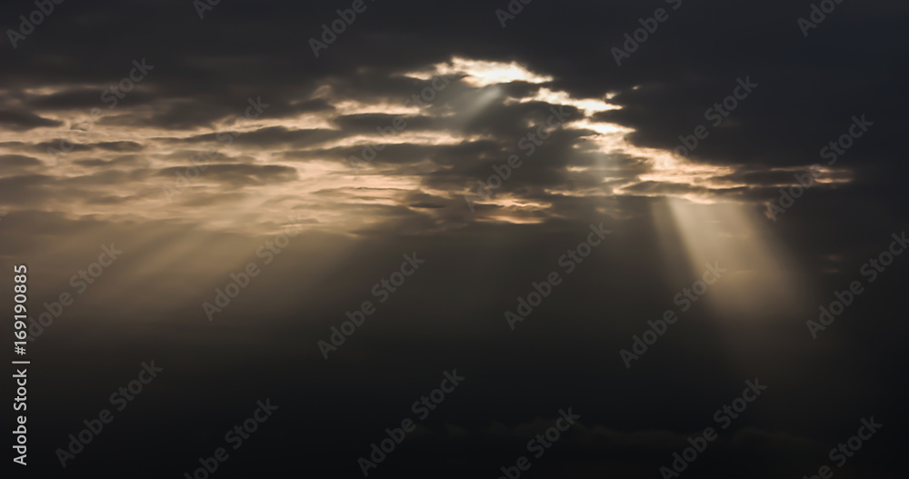 Dramatic atmosphere of beautiful light ray on tropical sunset sky and clouds.