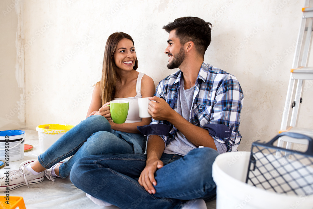 Happy young couple renovation new home Happy young couple renovation new home