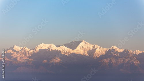 Close-up Kangchenjunga mountain in the morning with blue and orange sky that view from The Tiger Hill in winter at Tiger Hill, Darjeeling. India.