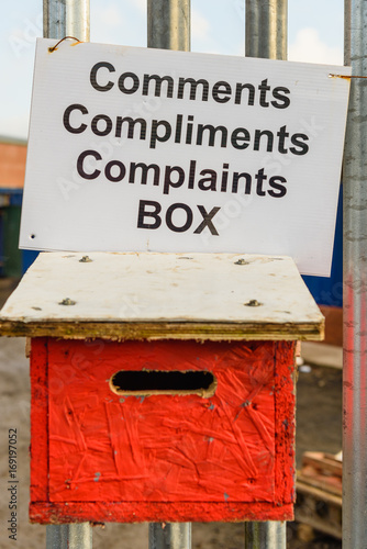 Comments, Compliments and Complaints box on the fence outside of a business.