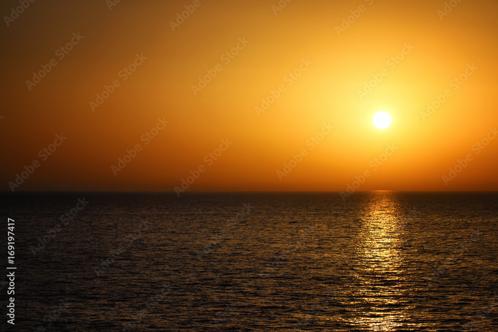Beautiful orange sunset with the sea. Summer landscape