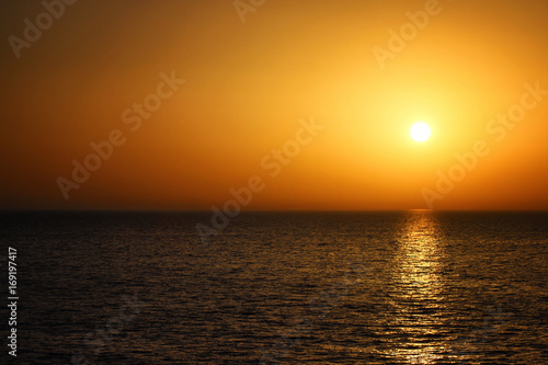 Beautiful orange sunset with the sea. Summer landscape