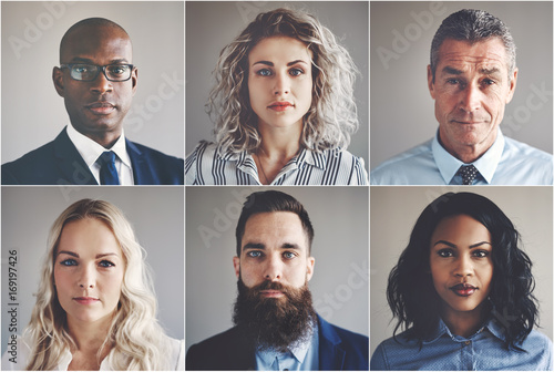 Ethnically diverse group of focused businessmen and businesswome