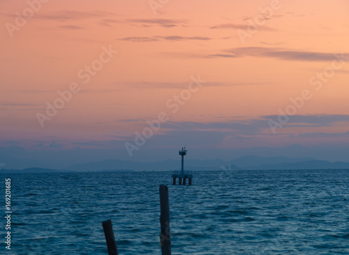 Navigation mark Buoy with sunset at Rayong, Thailand. © ekkaphan