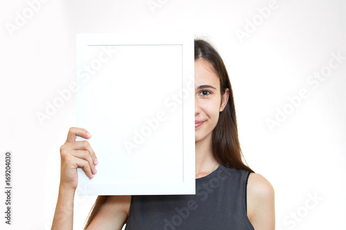 Woman hold white paper banner isolated over white background business girl
