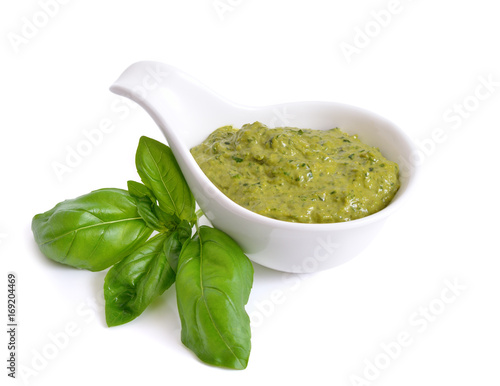 Pesto sauce in a bowl. Isolated On white.