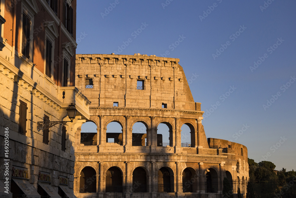Part of the wall of Colosseum (Coliseum) in Rome, Italy at sunset 