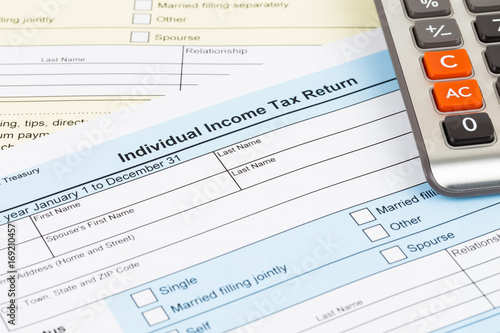 Tax form and calculator  document are mock-up © wirojsid
