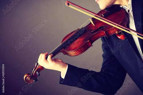 Obraz na płótnie Man man dressed elegantly playing violin