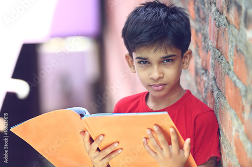 Indian Little Boy with Textbook