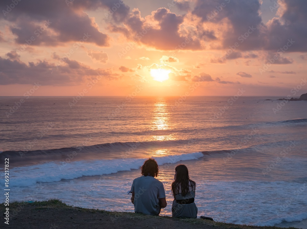 Portrait of a romantic young couple in love,woman and male sitting on the ground, lifestyle concept Portrait of a romantic young couple in love,woman and male sitting on the ground, lifestyle concept