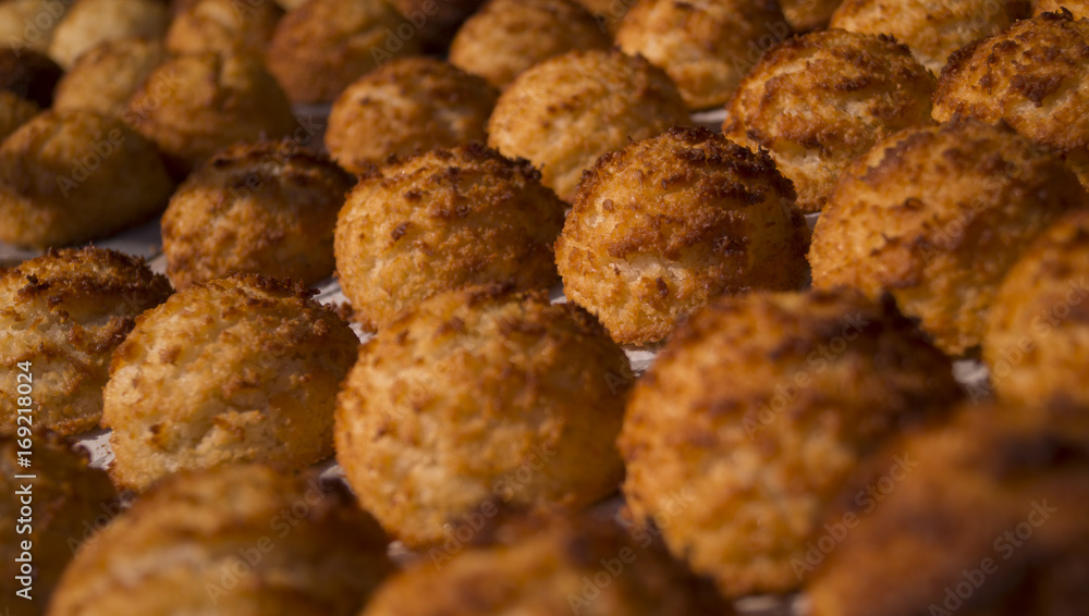 coconutmacaroons lined up nicely with the focus on one specific coconutmacaroon coconutmacaroons lined up nicely with the focus on one specific coconutmacaroon