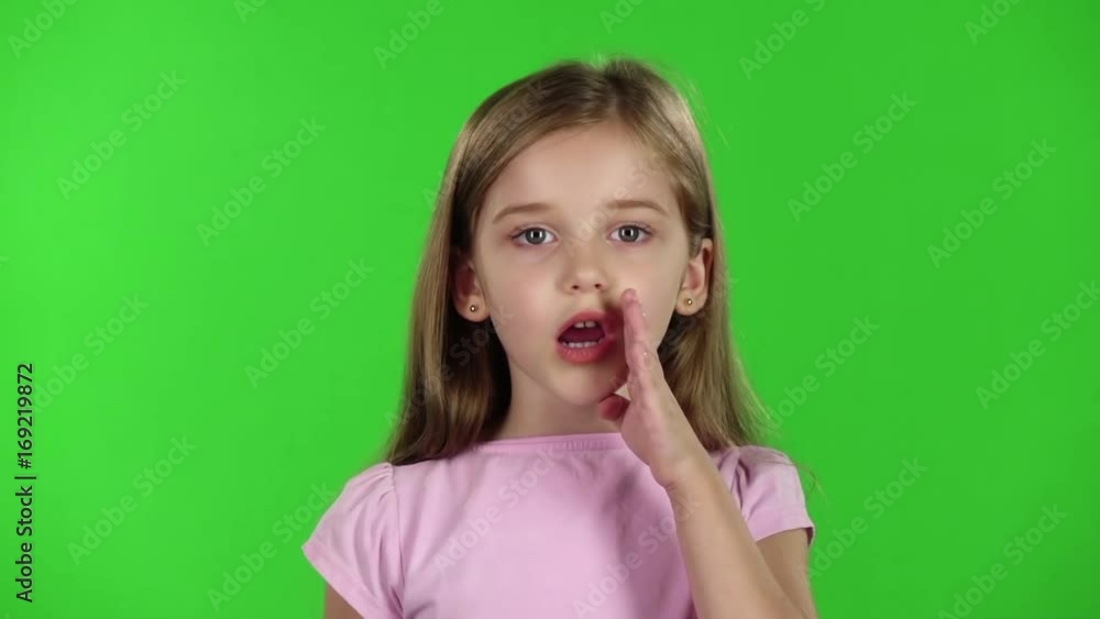 Baby speaks into a shout. Green screen. Slow motion Baby speaks into a shout. Green screen. Slow motion