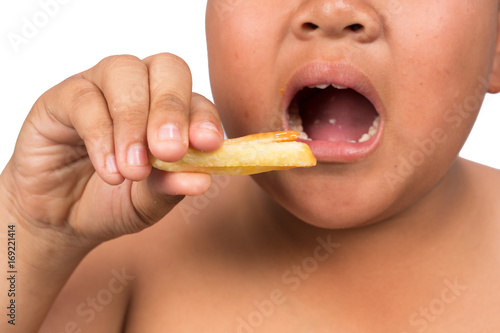 Fat Boy eating french fries, junk food.