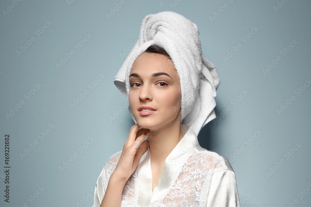 Obraz premium Beautiful young woman after shower on light background