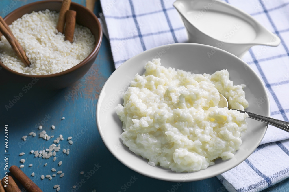 Delicious rice pudding in bowl on kitchen table Delicious rice pudding in bowl on kitchen table
