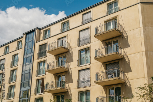 yellow building with steel balconies