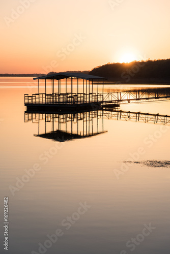 Sunset over boathouse on lake, Springfield, Missouri