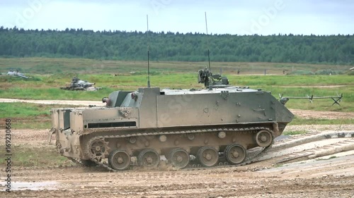 Slow motion shot of moving Russian armored personnel carrier photo